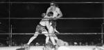 Tommy Loughran taking a swing at Primo Carnera. 