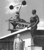 Bob Hoffman outside the York Barbell plant beneath a statue of himself and the revolving weightlifter sign that was visible from Interstate 83. 