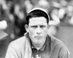 Edward Walsh, head-and-shoulders portrait, facing slightly right, in baseball uniform, with sweater on his right shoulder,