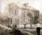 Daniel Drawbaugh and his grandson Roy Sheely, in front of Drawbaugh's workshop in Pennsylvania, c. 1902.