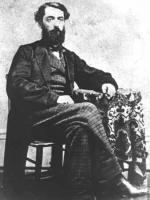 A portrait of a seated Edwin L. Drake in formal clothes.