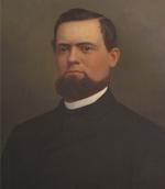 Oil on canvas, head and shoulders of a bearded man wearing a black suit and a white shirt.'