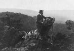 Joseph Rothrock and his dog look out over the edge of Eagles Rock.