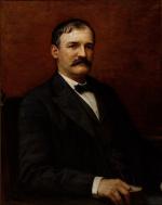 Oil on canvas of Pattison seated, wearing a suit.