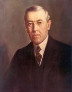 Oil on canvas of Wilson, wearing a dark suit, shite shirt, and a drak tie. Head and shoulders.