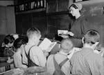 Mennonite teacher holding class in one-room, eight grade school house
'