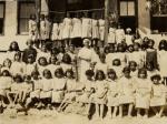 Group photograph of  Dr. Mabel E. Elliott and children suffering from trachoma. The location is Ismid, Turkey. 