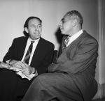 Steve Nelson (left), of Pittsburgh, the reputed head of the Communist Party of Western Pennsylvania, confers with his attorney Emanuel H. Block