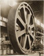 Worker standing beside a staggered tooth gear, Mesta Machine Company, West Homestead, PA, 1913.