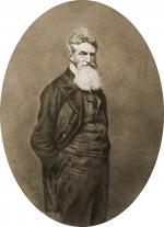 Photograph showing three-quarter length portrait of John Brown, with beard, facing slightly right.