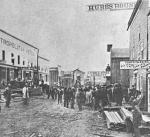 Pithole City was typical of many towns that sprang up and as quickly died around oil sites. Within six months of the discovery of oil in 1865, Pithole's population exploded from zero to 15,000. Here, construction along the main street during the boom is shown.'