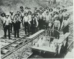 Track workers with tools, hand car in lower right Section gang Oakdale