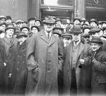 John Tener stands with a crowd in 1915