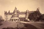 New Bryn Mawr Hotel, Flower Beds, 1891, by William Rau. Photograph of the magnificent hotel, with turret a large, roofed, arched openings porch above the entrance.  