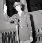 Jimmy Stewart in uniform, waving.