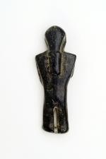 Carved steatite human effigy, reverse.'