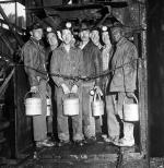 Soft coal miners return to work ... miners stand in the elevator cage, ready to descend into the H.C. Frick coke company mine to work their first shift since settlement of the soft coal strike. 