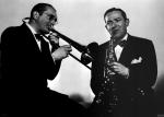 Tommy Dorsey playing the trombone and Jimmy Dorsey playing the saxophone 