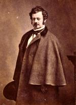 Edwin Forrest, half-length portrait, standing, facing left, wearing caped overcoat.