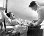 Former Yale Law School student who opposed the war, contracted hepatitis for the sake of science, bares his arm for the nurse's blood taking needle.