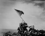 Black and white image of men raising the American flag on Iwo Jima