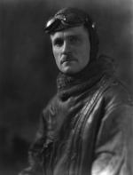 Head and shoulders portrait, facing front; in flying gear.