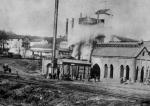 Image of the furnace complex and workers.